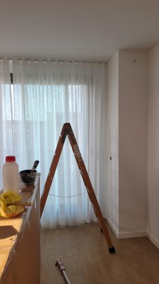 cream curtains hanging at window