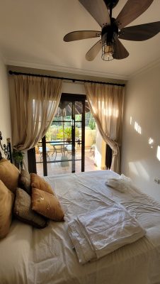 triple pinch pleated curtains in a bedroom